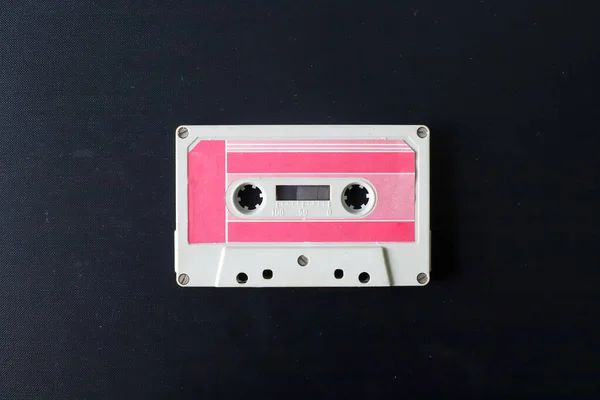 Old tape cassette, old or aged wood background. solated casette