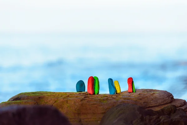 Painted stones on coast — Stock Photo, Image