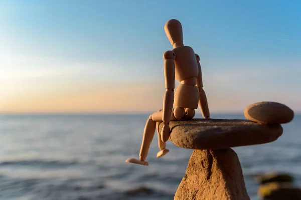 Wooden dummy on stone — Stock Photo, Image