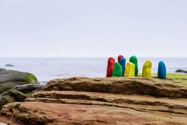 Pebbles on sea boulder — Stock Photo, Image