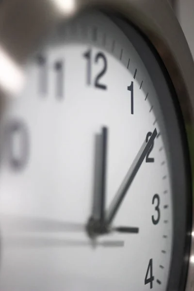 White and gray kitchen clock ticking