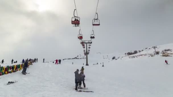 Skiers on the skilift - skiing on slope in ski resort. 4K TimeLapse. January 2017, Kazakhstan — Stock Video