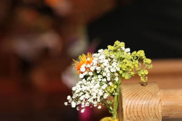 wedding flower in Church seats. white and yellow flowers