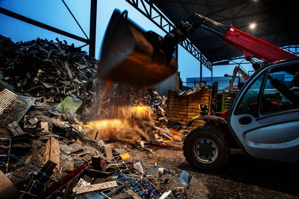 garbage pile getting sorted for recycling of materials