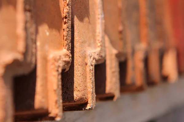 red roofing tiles lined up in a row