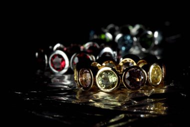 Jewelery with gem stones on tin foil