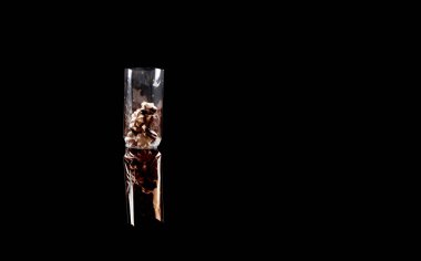 sweets in plastic food packaging with reflection and copy space
