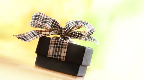 Brown christmas present with ribbon — Stock Photo, Image