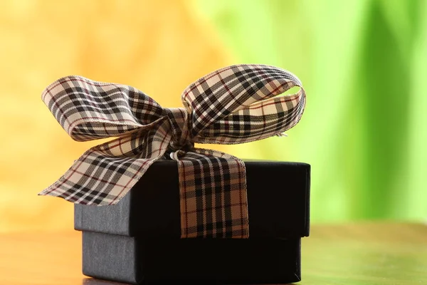 Presents on a table with a bow. Background space for copy — Stock Photo, Image