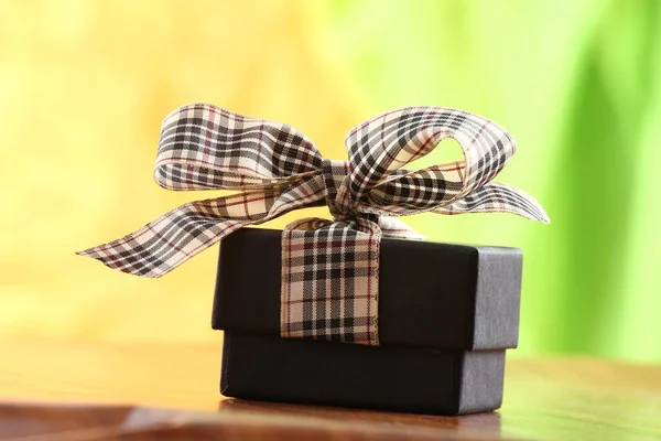 Presents on a table with a bow. Background space for copy — Stock Photo, Image