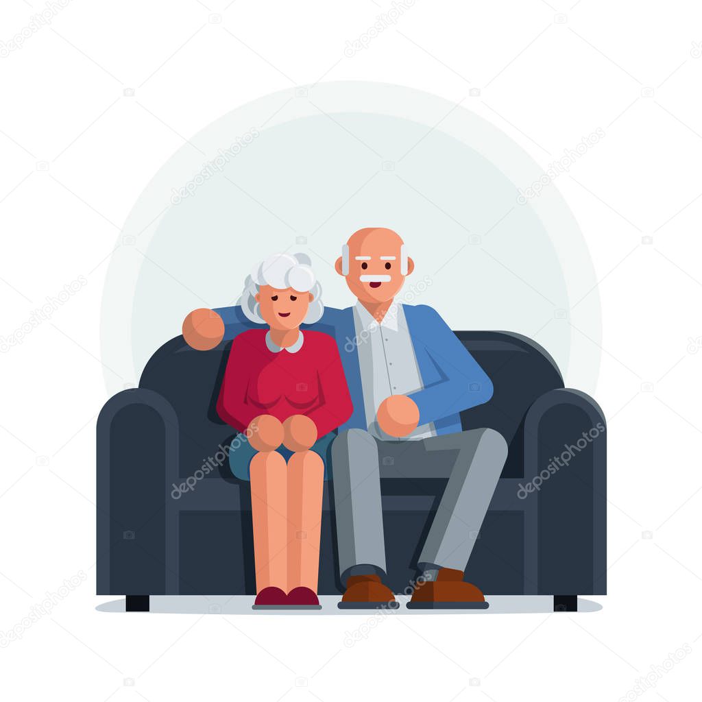 Happy elderly couple sitting on a sofa together