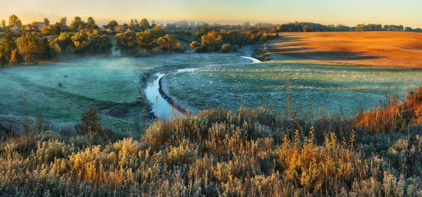 autumn river. scenic sunrise in a river valley. foggy morning