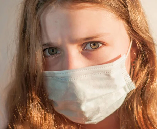 A girl in a medical mask