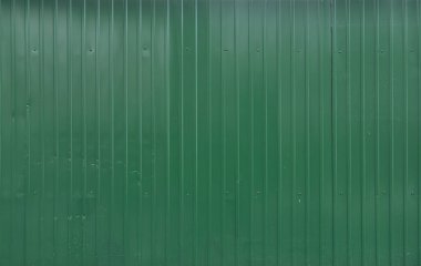 Yeşil metal döşeme. Yapraklar yeşil kıvrımlı demirden