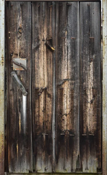 Vecchia porta di legno. Texture vintage della superficie della tavola della foglia della porta — Foto Stock