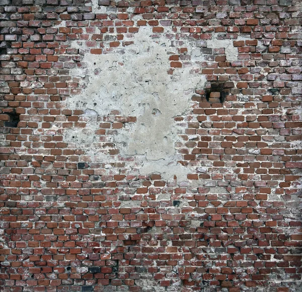 Старая кирпичная стена из красных блоков с рассыпающейся текстурой . — стоковое фото