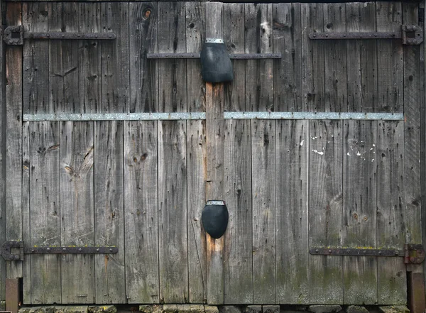 Gray wooden double door, old garage door, taupe boards — Stock Photo, Image