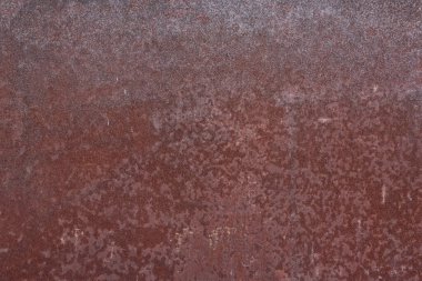 Demir paslı çarşaflar. Boya desenli metal bir duvar.