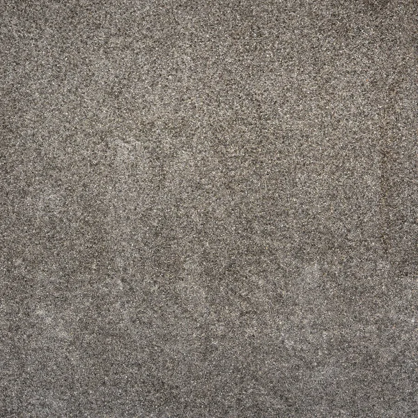 Szara ściana z dekoracyjnymi wiórami z betonu stiukowego — Zdjęcie stockowe