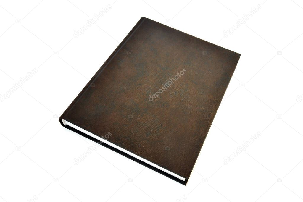 Book in a brown leather cover on a white background