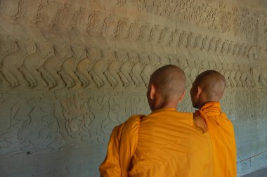 monks exploring Angkor wat temple clipart