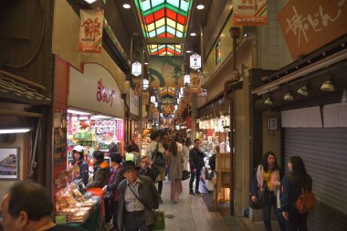 Customers at illuminated Nishiki Market, Kyoto