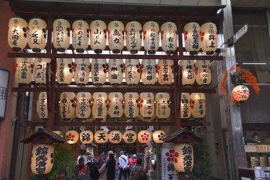 Customers at illuminated Nishiki Market, Kyoto
