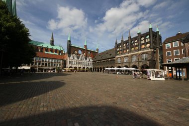 tourist visit Market Square with City Administration building in Lubeck clipart