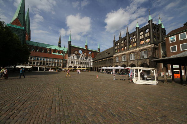 Tourist visit Market Square with City Administration building in Lubeck