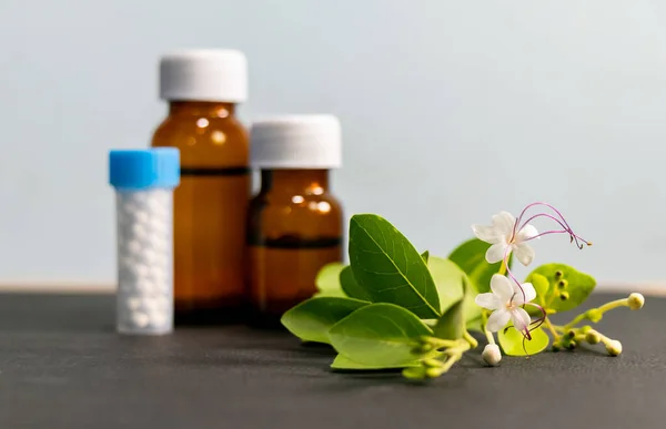 Close Shot Green Medicinal Herbs Transparent Amber Glass Bottles Defocused — Stock Photo, Image