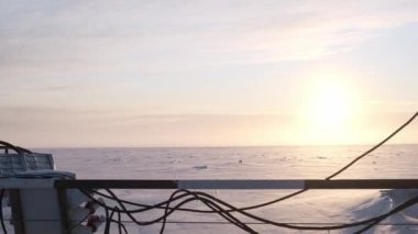 The ship froze in the ice of the river.