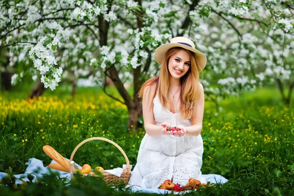 Beautiful Young Girl Holds Out Strawberry Her Hands Smiles Charming — Stock Photo, Image