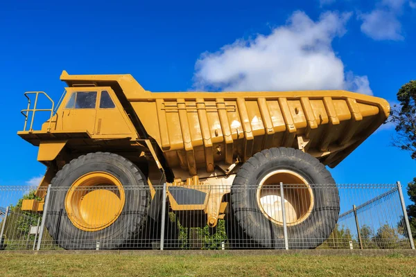 A massive 100-ton haul truck. Oversized dump trucks like this are used in the mining and heavy construction industries