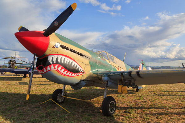 A Curtiss P-40E Kittyhawk, an American fighter plane from World War Two. This example has a distinctive "shark teeth" nose. Mount Maunganui, New Zealand, January 18 2020
