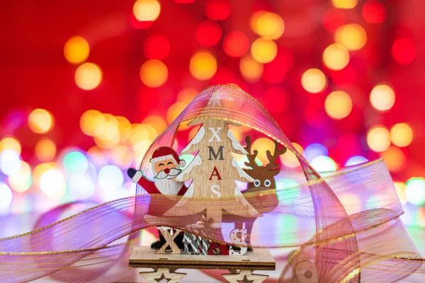 Wooden Christmas sledge with Santa Claus, a reindeer and Christm — Stock Photo, Image