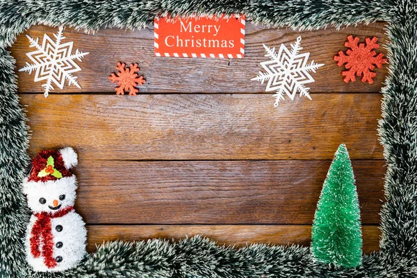 Christmas composition on wooden board with Christmas garland and — Stock Photo, Image