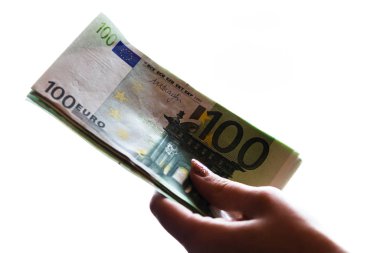 Kadın eli rüşvet gibi para veriyor ya da beyaz torbaya izole edilmiş bahşişler.