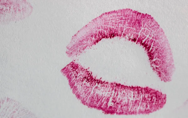 Valentine`s day concept. Lipstick kiss isolated on white paper.