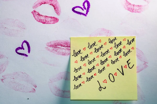 Valentine`s day concept. Lipstick kiss. Writing and drawing with — Stock Photo, Image