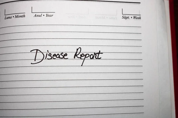 Relatório da doença, texto de caligrafia na agenda do escritório. Entendido. — Fotografia de Stock