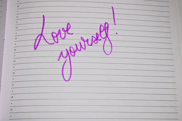 Love yourself, handwriting text on page of office agenda. Copy s — Stock Photo, Image