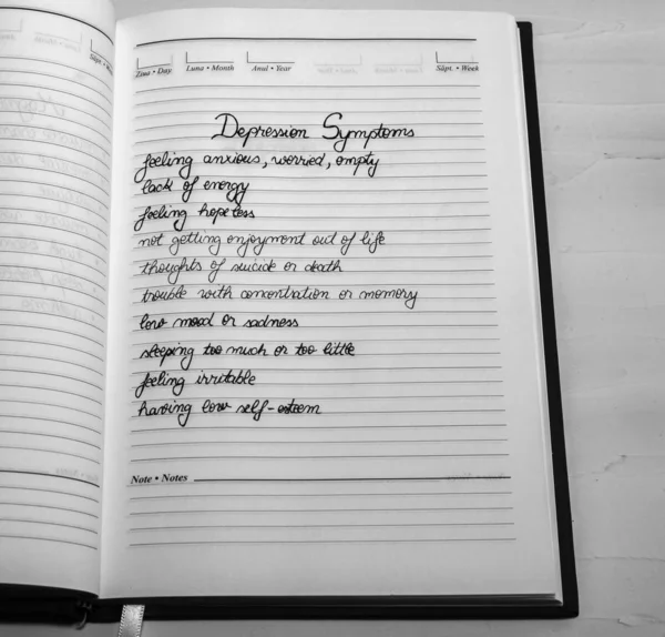 Sintomi di depressione, calligrafia a pagina dell'agenda dell'ufficio . — Foto Stock