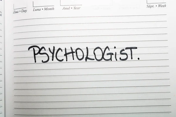 Psychologue, texte manuscrit sur la page de l'ordre du jour du bureau. Copier sp — Photo
