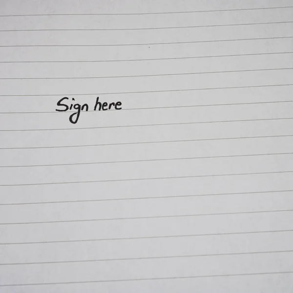 Sign here, handwriting text on page of office agenda, office spi — Stock Photo, Image