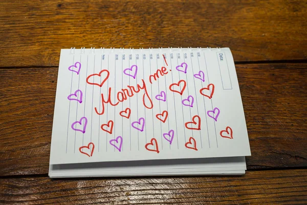 Marry me, writing love text on paper, lovely message. Text on sp — 스톡 사진