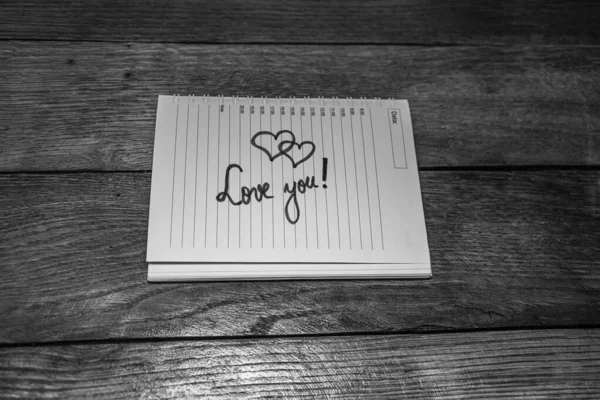 Love you, writing love text on paper, lovely message. Text on sp — 스톡 사진