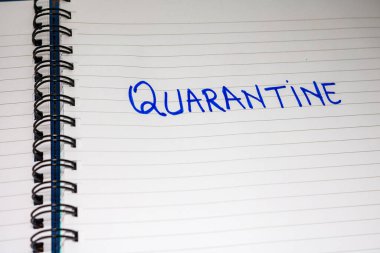 Quarantine handwriting  text on paper, on office agenda. Copy sp