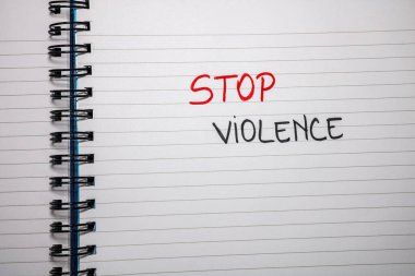 Stop violence handwriting  text on paper, on office agenda. Copy