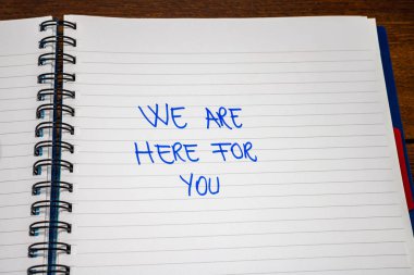 We are here for you handwriting  text on paper, on office agenda clipart