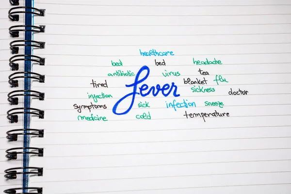 Fever symptoms handwriting  text on paper, on office agenda. Cop — 图库照片